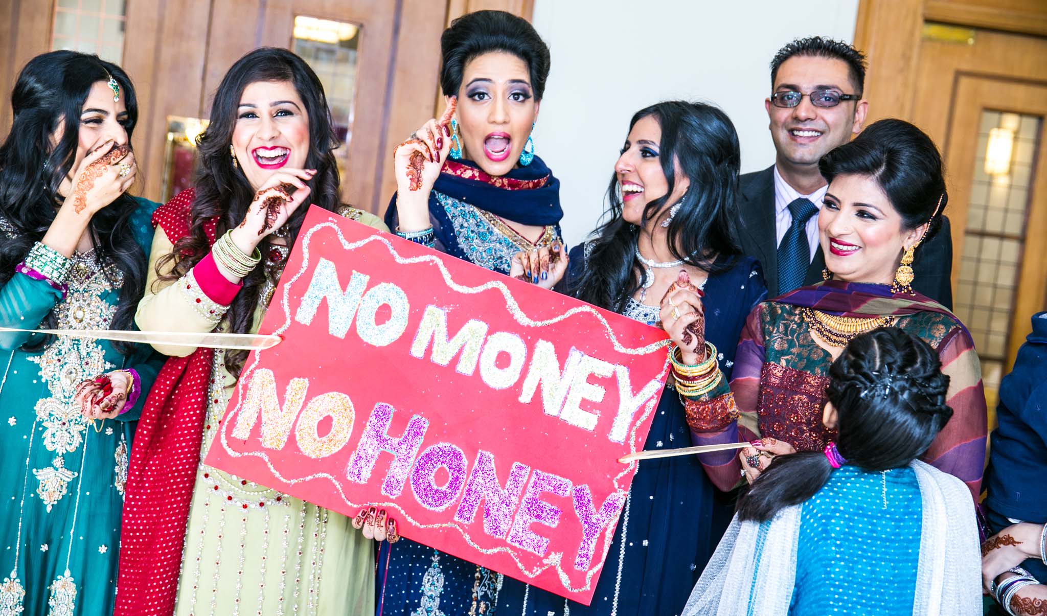 Wedding Photography of Indian wedding gate 'No Money No Honey' by MAKSAM Photography London