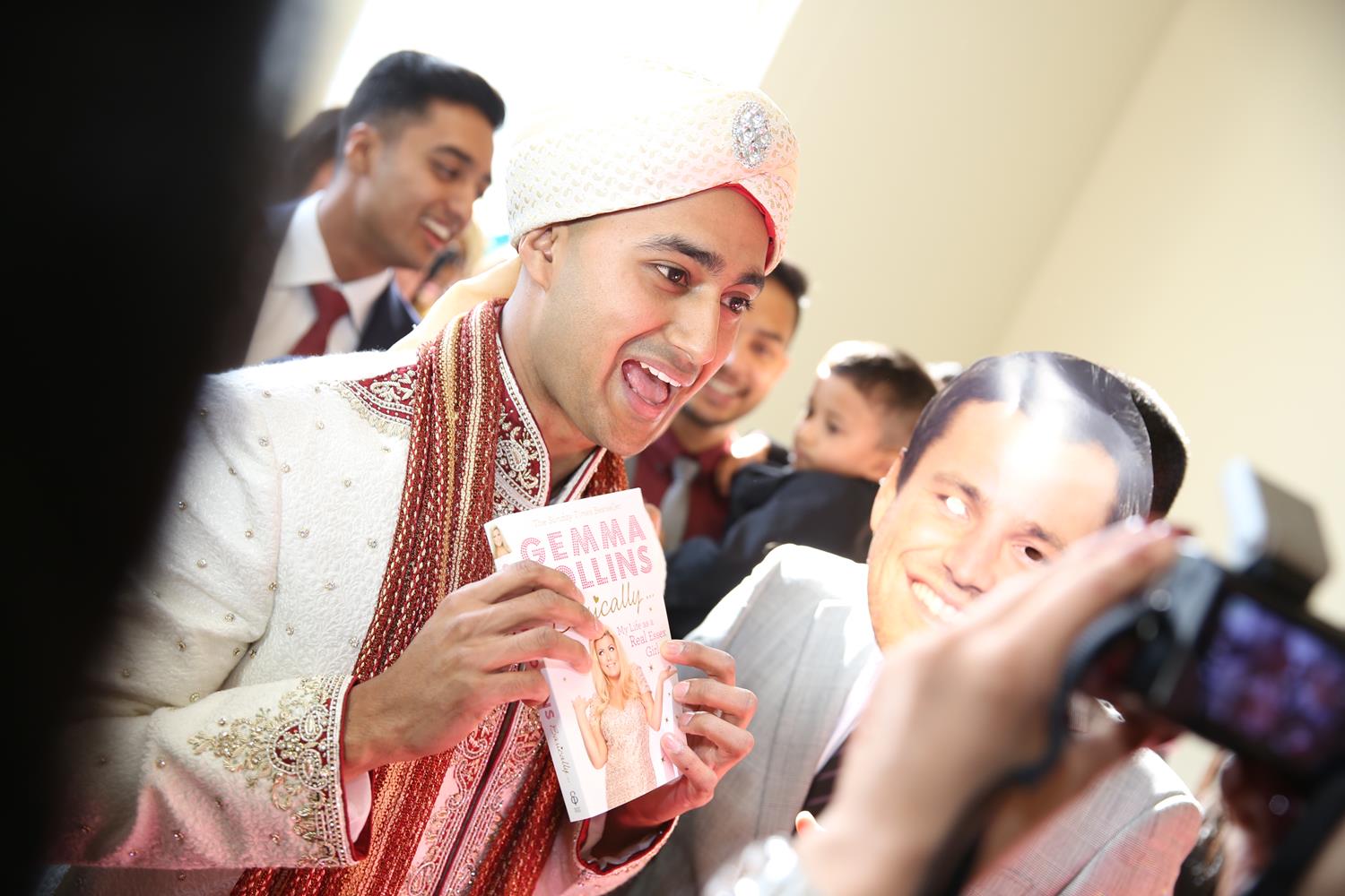 Wedding Photography of Groom arriving at gate at his Asian Wedding by MAKSAM Photography London