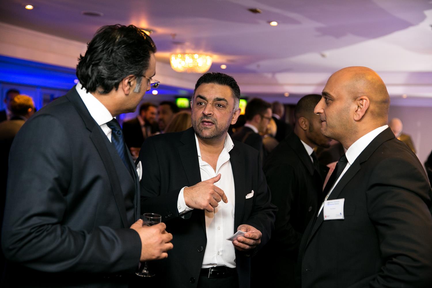 Corporate Photography of three business men talking taken by MAKSAM London Photographer