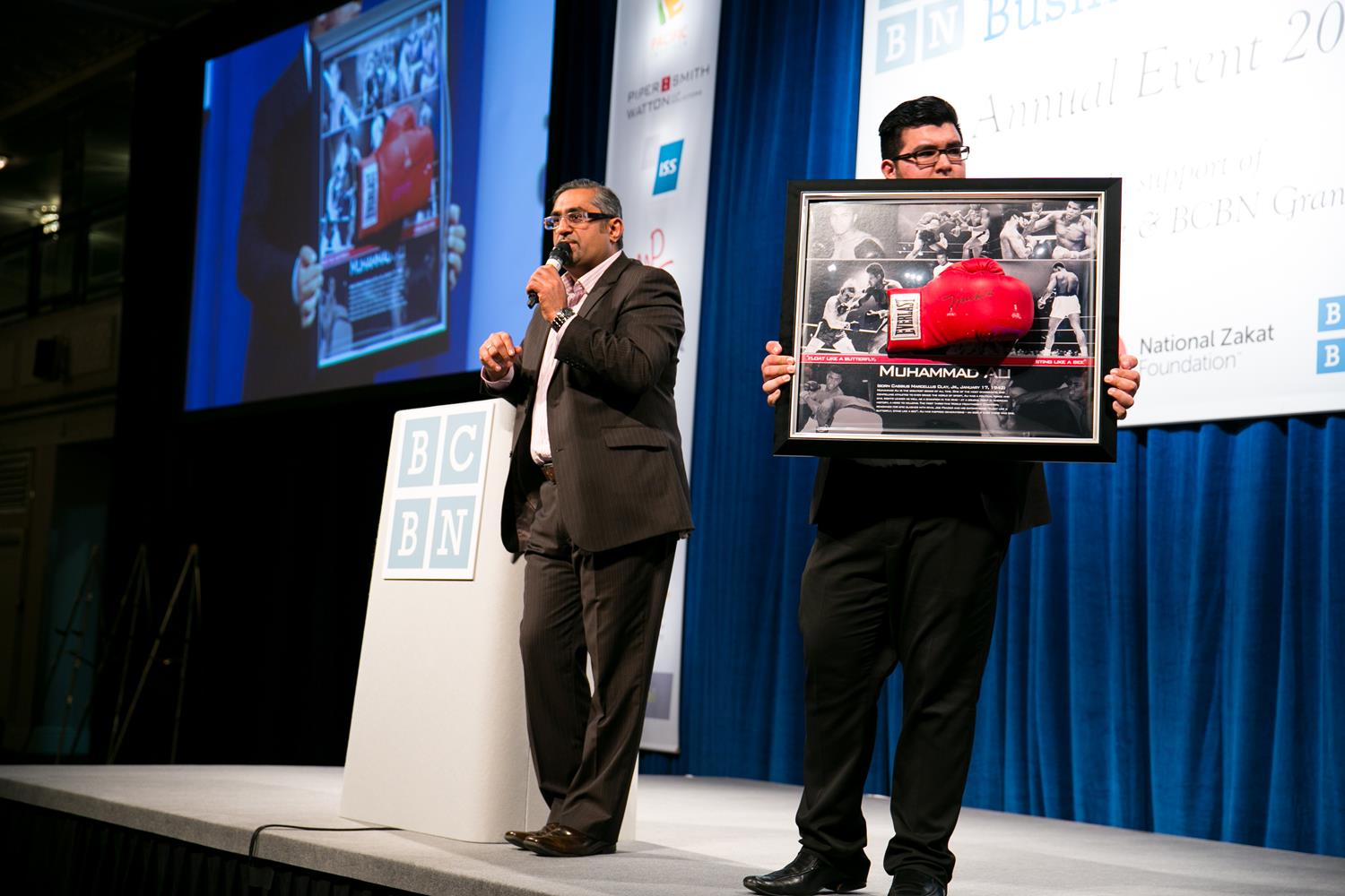 Corporate Event Photography auctioning Muhammad Ali Gloves by MAKSAM Corporate photographer