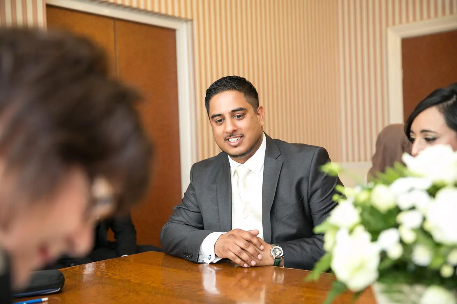 Registry Photography groom looking at registrar by MAKSAM Photography