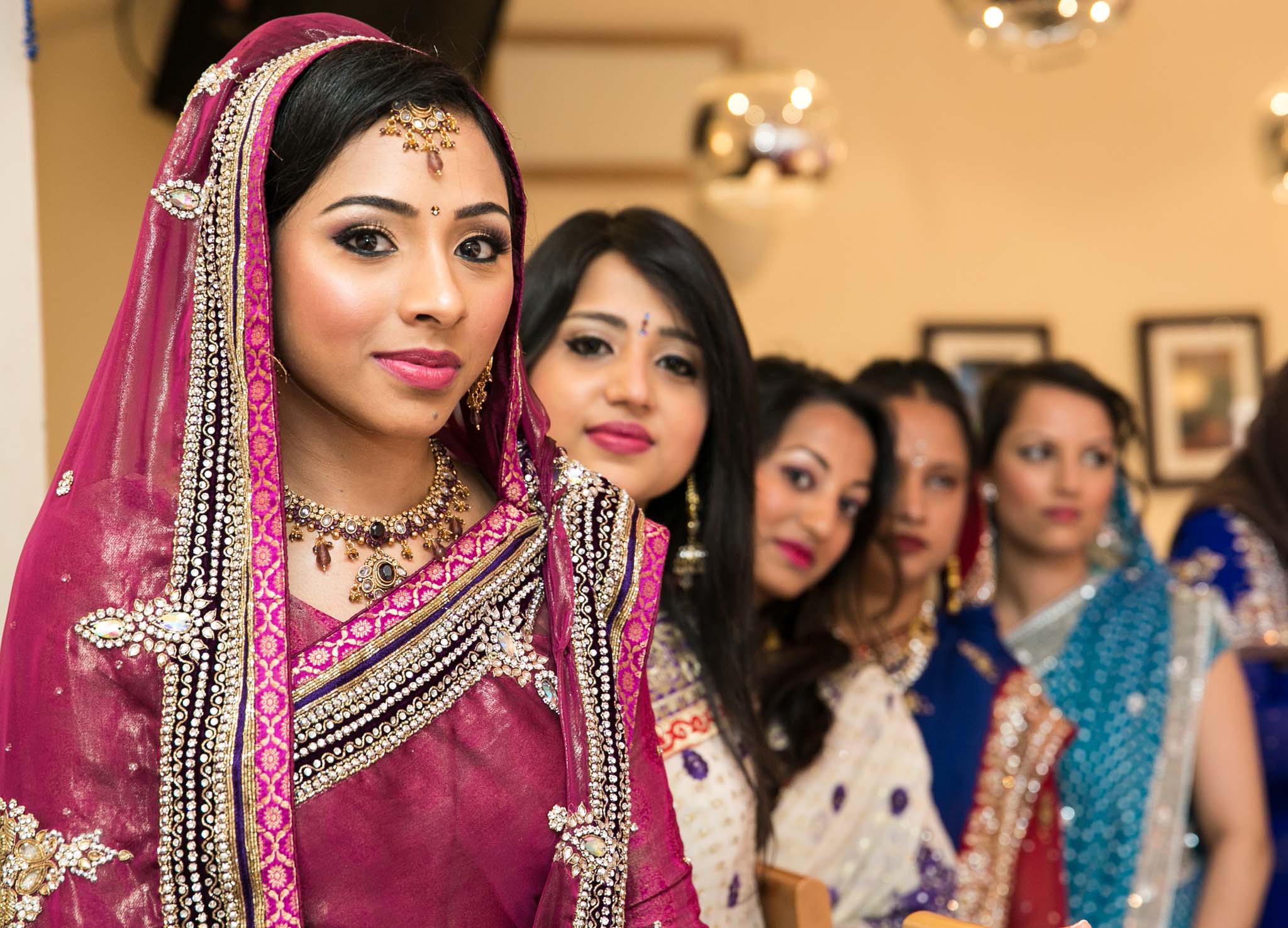 Bengali Wedding Photography of Bridge and sisters at London Wedding by MAKSAM Photography London