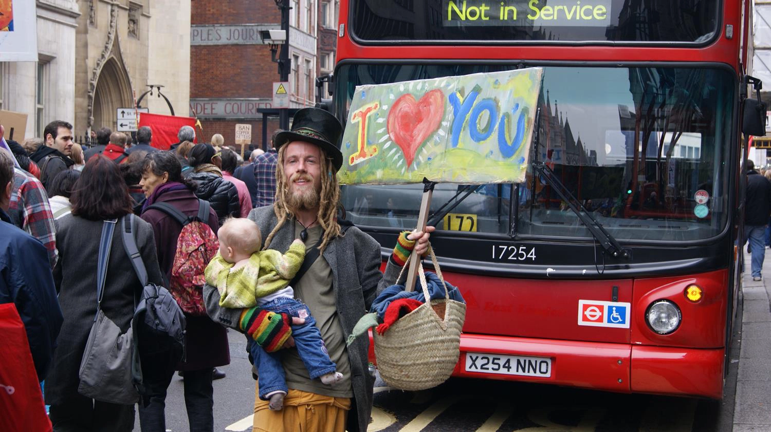 London hipster holding "I Love You" banner with baby taken by London Photographer by MAKSAM Photography