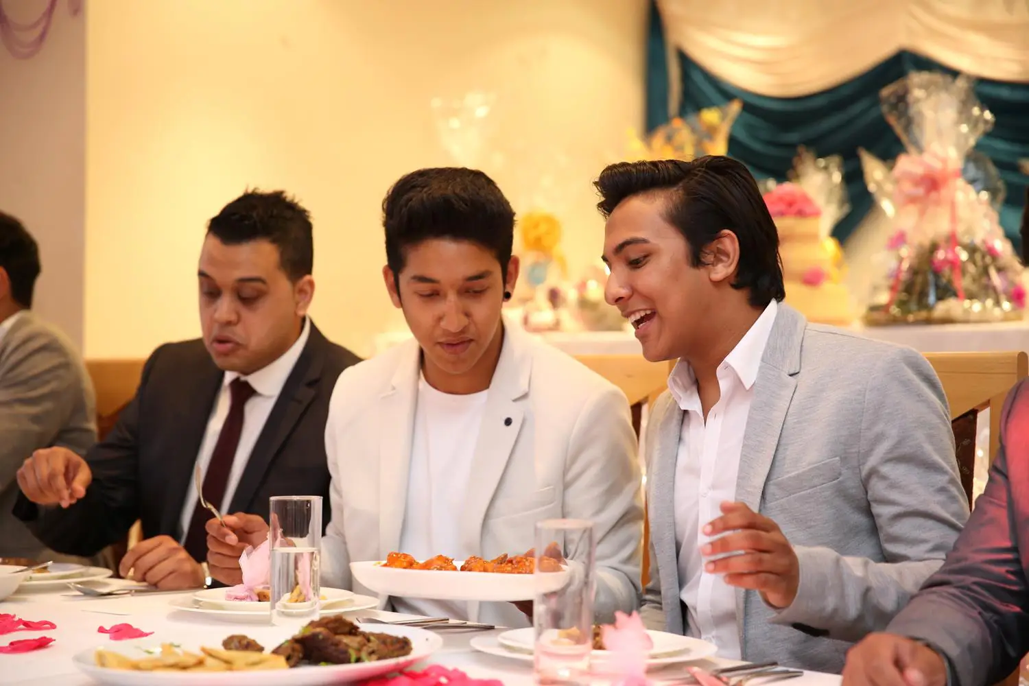 Guests at Asian Wedding with friends by MAKSAM Photography