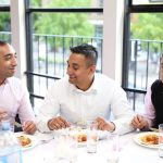 Guests at Asian Wedding Dinner Table by MAKSAM Photography