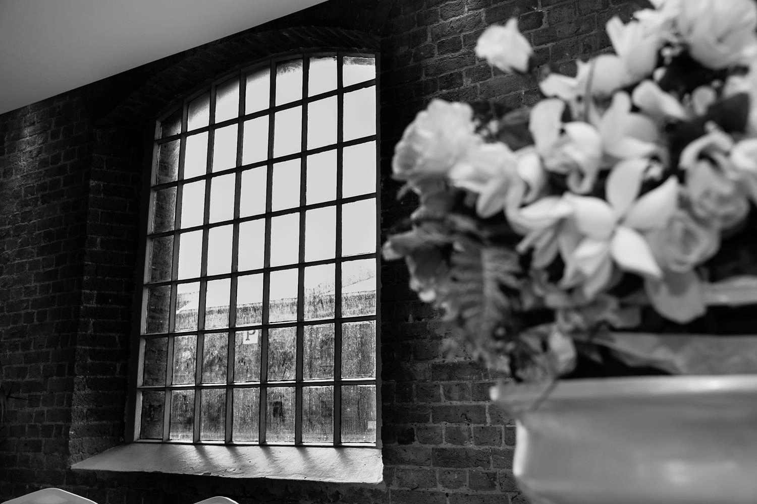 Black and White square glass window at London Wedding by MAKSAM Photography