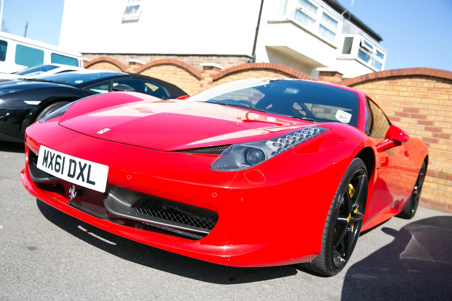 Red Ferrari Car at London Wedding by MAKSAM Photography