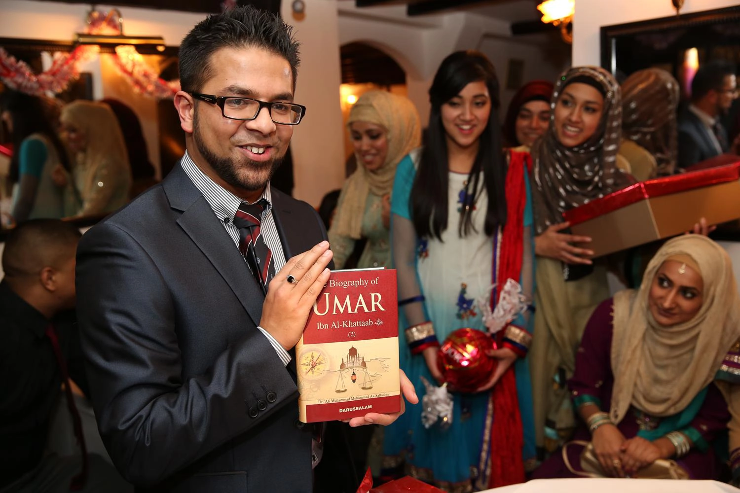 Bengali Engagement Photography Umar Ibn Al-Khattab book gift in London by MAKSAM Photography