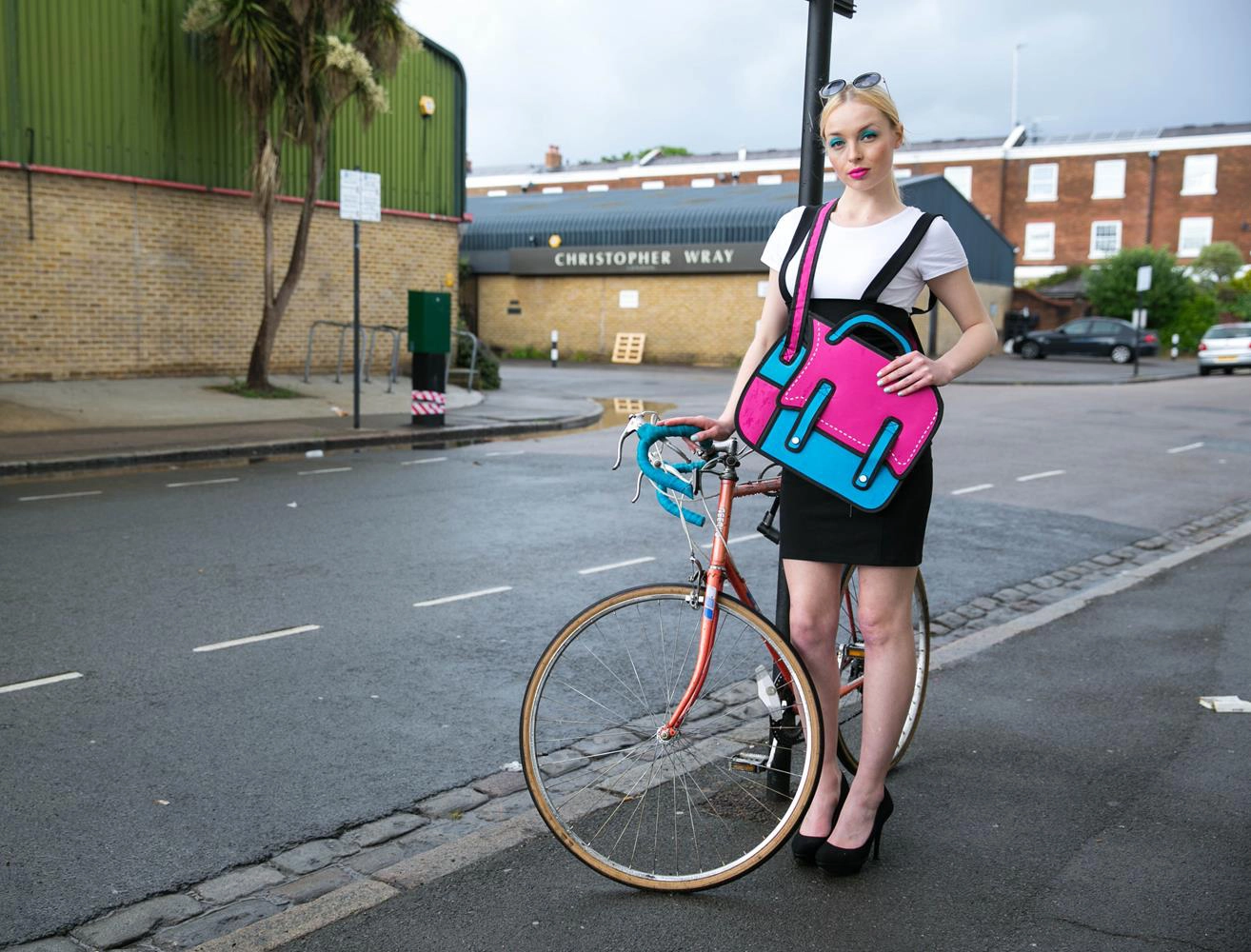 Product photography London of Model with bag and bike by MAKSAM Photography
