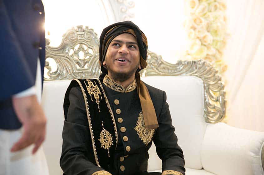asian wedding groom smiling before